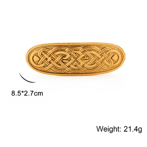 Vintage gold Celtic knot hair clip for women with detailed embossed metal weaving patterns
