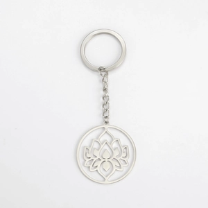 Detailed view of silver stainless steel keychain with hollow lotus pendant and metal chain