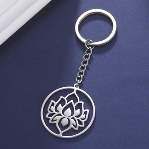 Stainless steel keychain with polished hollow lotus flower pendant on blue background