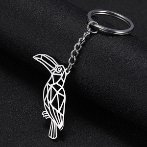 Detailed view of a geometric hollow toucan pendant keychain made of polished stainless steel