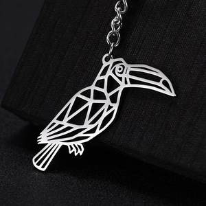 Minimalist silver stainless steel woodpecker keychain with geometric cutout design