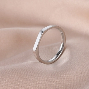 Minimalist geometric faceted stainless steel ring with a high polished silver finish