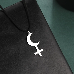 Silver Lilith crescent cross pendant necklace on black leather cord with minimalist design