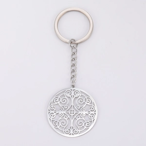 Detailed view of silver stainless steel keychain with intricate hollow scroll pattern