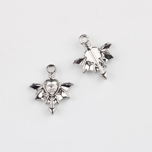 Detail view showing front and back of Gothic wing heart pendant with zircon inlay
