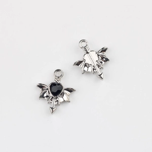 Detailed silver winged heart pendant with black gemstone and gothic arrow design