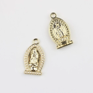 Detailed close-up of golden Virgin Mary pendants with pearls for jewelry making