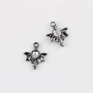 Detailed view of gunmetal heart-shaped bat wing pendant with clear zircon inlay