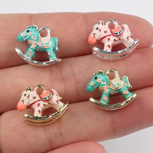 Cute enamel rocking horse charms in pink and green for DIY jewelry making and bracelets