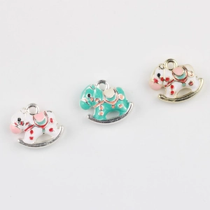 Detail view of alloy rocking horse pendants with colorful enamel for DIY jewelry making