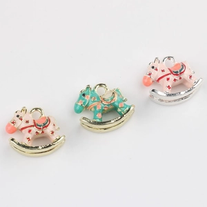 Three enamel rocking horse pendants in pink and blue for DIY jewelry making