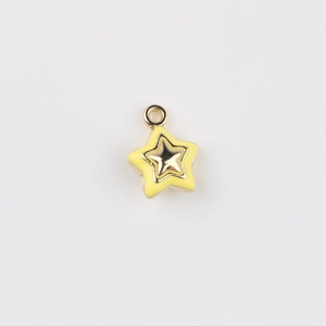 Detailed view of a yellow enamel and gold alloy star pendant for DIY jewelry making