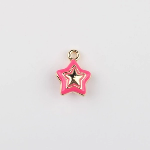 Close-up of pink enamel star charm with gold alloy double-layer design for DIY jewelry