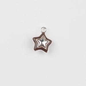 Macro view of a double-layered star pendant with brown enamel finish and silver metal