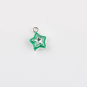 Macro detail of silver star pendant with green enamel finish and integrated hanging loop