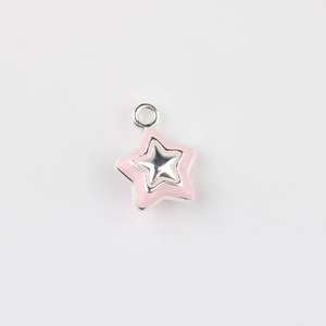Detailed view of pink enamel star charm with silver alloy frame for DIY jewelry making