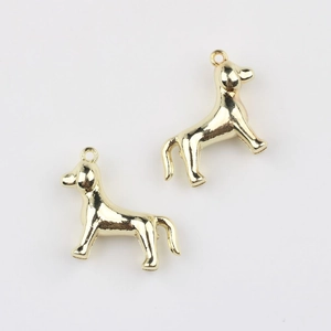 Detailed close-up of golden dog-shaped alloy pendants for DIY necklace jewelry making