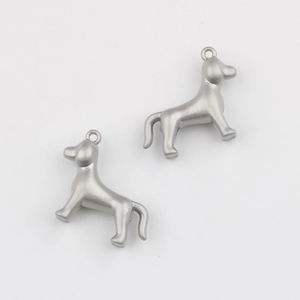 Close-up of matte silver 3D puppy charms with rings for DIY jewelry making