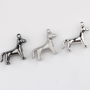 Detailed view of dog-shaped alloy pendants in gunmetal, matte silver, and chrome finishes