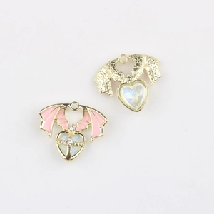 Detail of pink and iridescent heart pendants with wings and sparkling zircon inlays