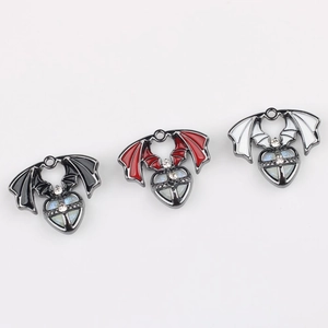 Three gothic bat wing heart charms with rhinestones in black, red, and white colors