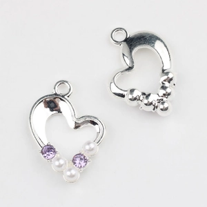 Detailed front and back view of silver heart pendant with purple zircons and pearls