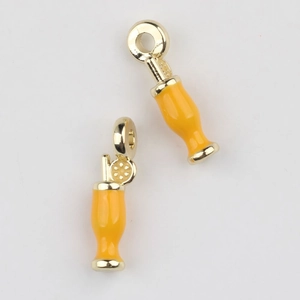 Detailed view of yellow enamel drink charms with lemon slices and straws for DIY jewelry