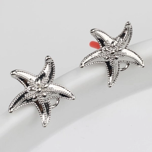 Boucles d'oreilles minimalistes étoile de mer en argent S925 avec fini texturé
