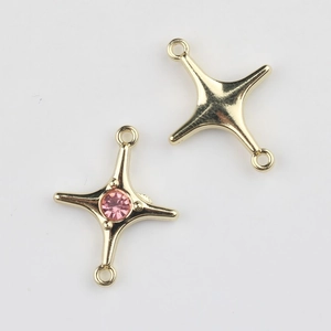 Detailed front and back view of gold star jewelry connector with pink zircon stone
