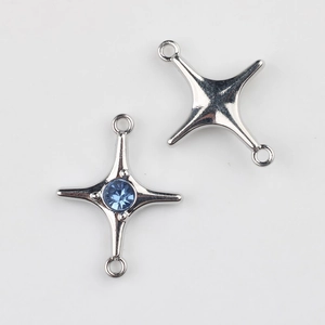 Detail of alloy star connector with blue zircon and dual loops for DIY jewelry making