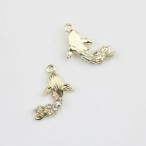 Detailed view of alloy koi fish pendants with gold plating and sparkling zircon inlay