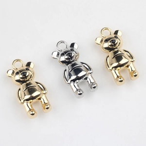 Minimalist gold and silver bear-shaped alloy pendants with polished metallic finish