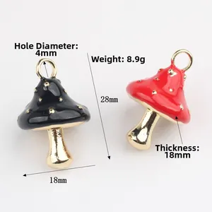 Minimalist painted mushroom pendants in red and black with dimensions 28x18mm