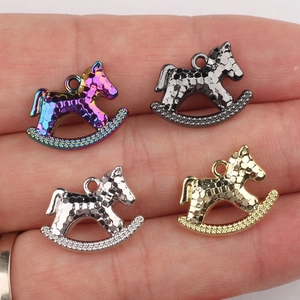 Set of four rocking horse charms in mixed metallic finishes for DIY jewelry making