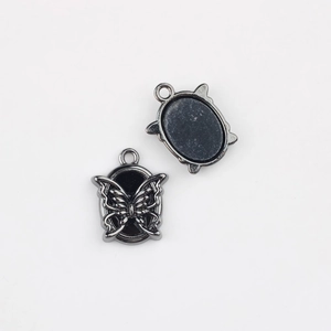Detail view of oval butterfly pendant charm in black nickel alloy for DIY jewelry making