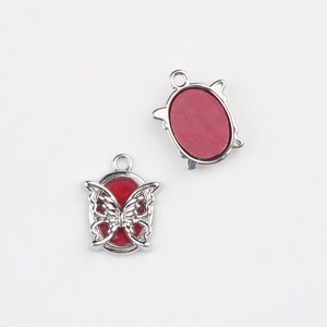 Detailed front and back view of silver alloy butterfly pendant with red resin inlay