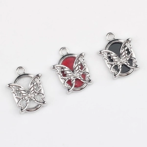 Three minimalist butterfly oval pendants in white, red, and black alloy for DIY jewelry