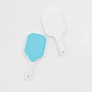 Detail of mini pickleball paddle pendants with honeycomb texture for DIY keychains