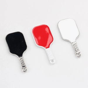Detailed view of mini pickleball paddle pendants in black, red, and white alloy finish