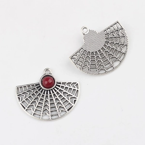 Detail of fan-shaped alloy pendant with red resin inlay and vintage silver finish