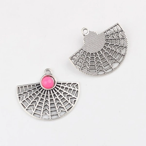 Detail of fan-shaped alloy charms with pink beads and hollow design for DIY jewelry making