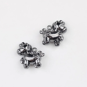 Close-up of gunmetal-plated little pony charms for DIY jewelry and keychain accessories