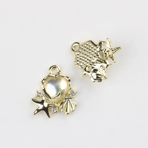 Macro detail of alloy starfish heart pendant showing golden texture and iridescent resin
