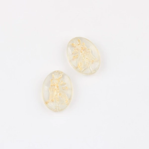 Close-up of Czech glass beads featuring gold gilded cat pattern for DIY jewelry crafts