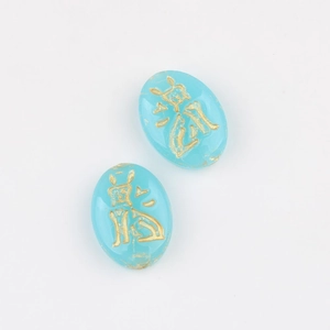 Detail view of turquoise glass beads with double-sided gold-gilded Chinese characters