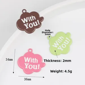 Three cloud-shaped oil-drip alloy pendants in pink, green, and brown colors with With You text