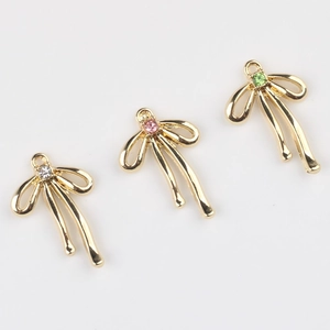 Trois pendentifs nœuds dorés avec zircons colorés pour la création de bijoux DIY