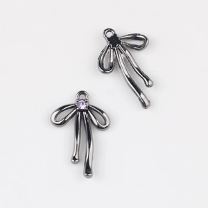 Détails de breloques nœuds noirs avec zircon violet pour la création de bijoux DIY