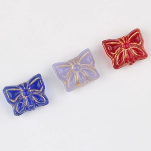 Handmade Czech glass butterfly beads with gold patterns in blue, purple and red colors