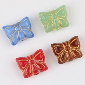 Vintage butterfly glass beads with gold-rimmed details in four colors for DIY jewelry